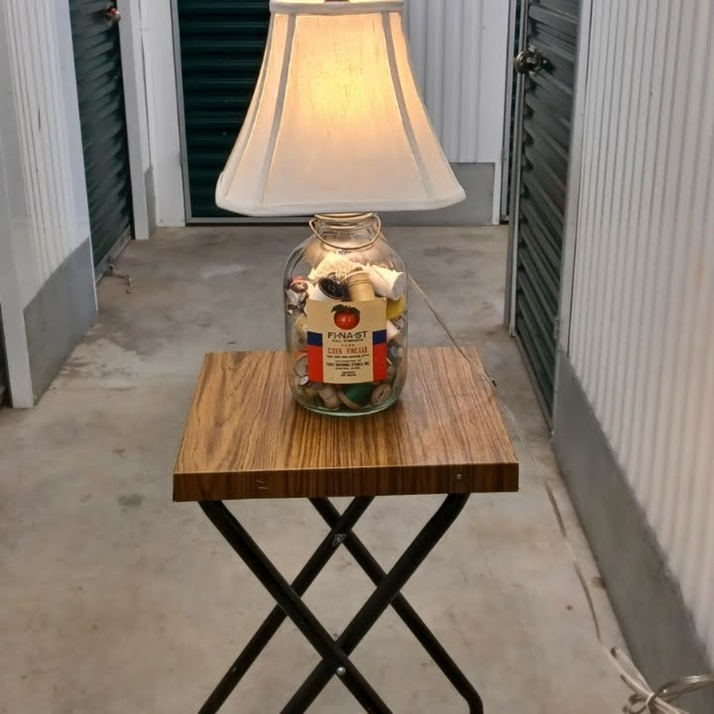 Sewing enthusiasts table lamp from upcycled cider bottle
